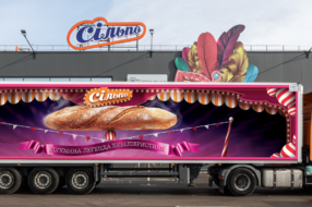 Цирк на колесах: українська мережа супермаркетів розмалювала свої вантажівки